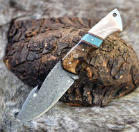 The Hunter's Edge: 8.25-Inch Gut Hook Skinning Hunting Knife with Raindrops Damascus Steel Blade, Rosewood and Epoxy Resin Handle