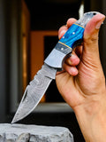 Blue Ridge Damascus Pocket Knife with exotic wood handle, folded for easy storage and carrying